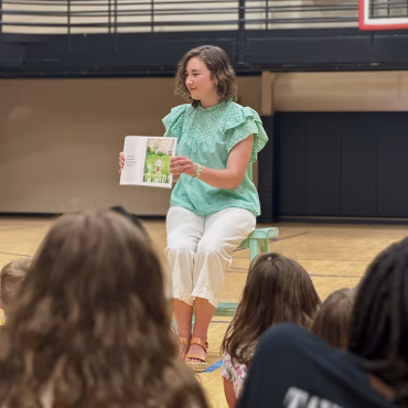 Maddie Martel reading the Little Teacup at Marvin Academy Christian School