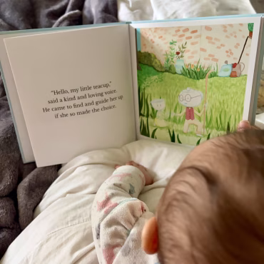 baby reading in bed The Little Teacup book